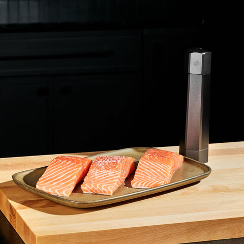 HexClad HexMill next to common items to show 1 lb scale and easy countertop fit