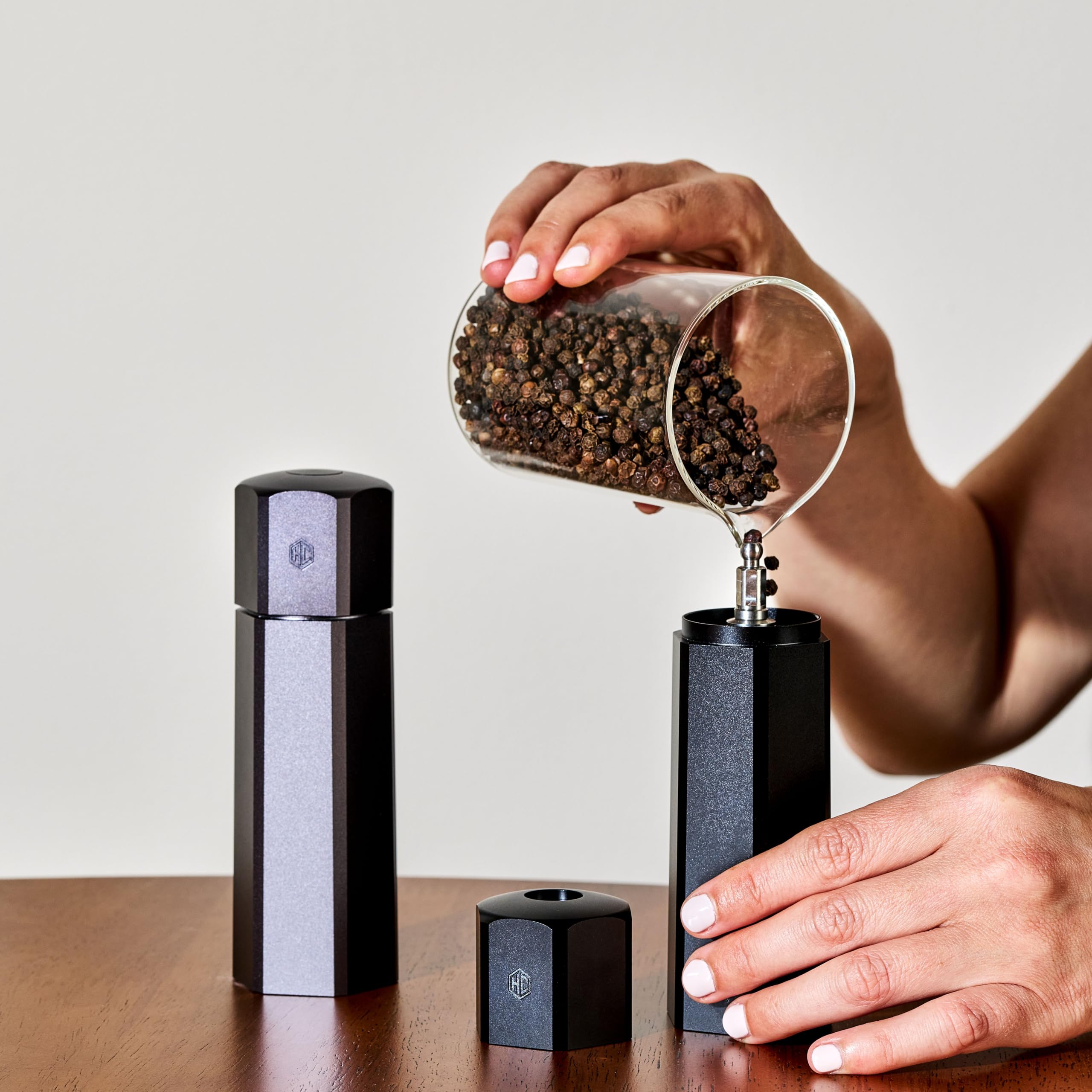 HexClad HexMill held in hand to show 5¼-inch size for comfortable use