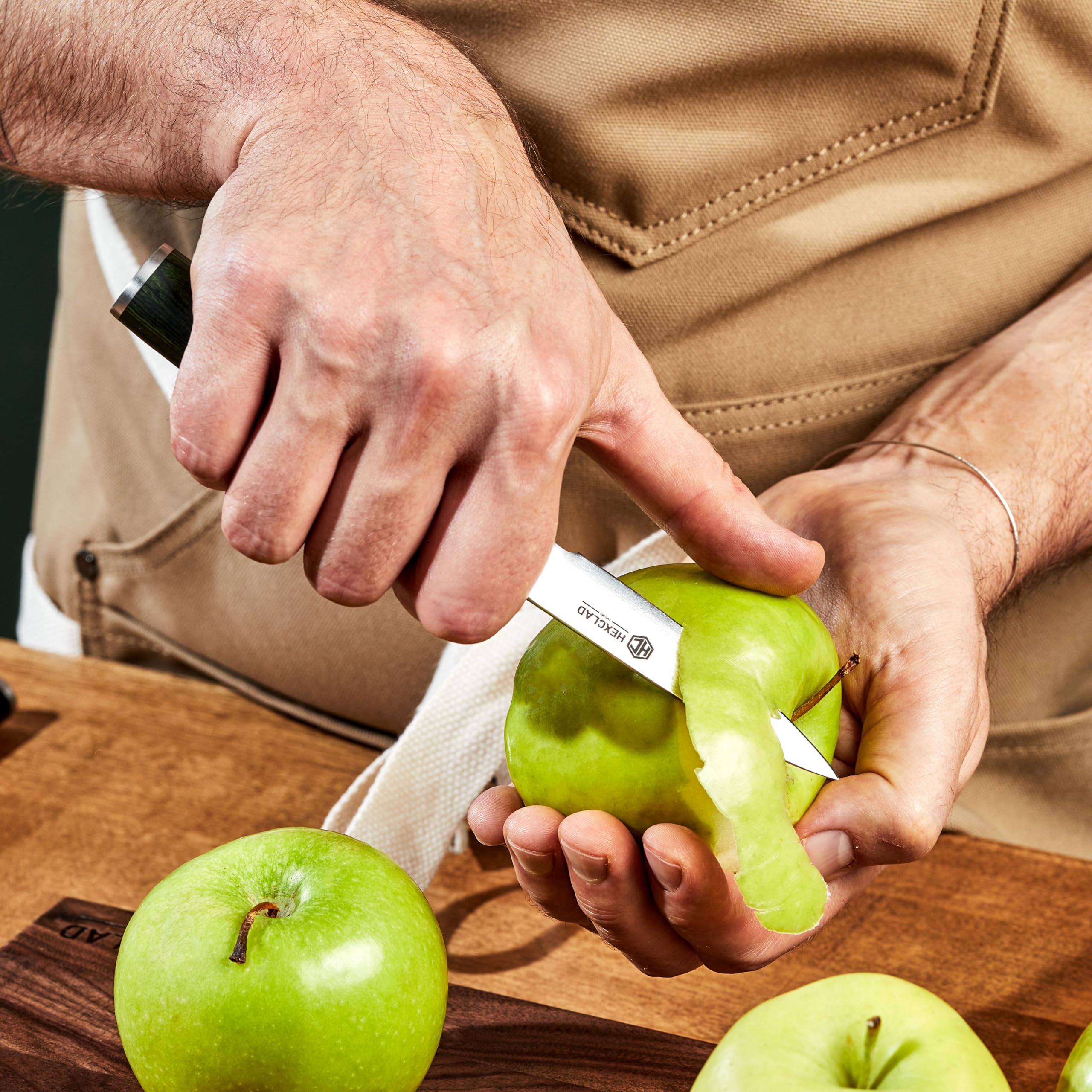 HexClad knife on wood cutting board showing safe prep surface benefit