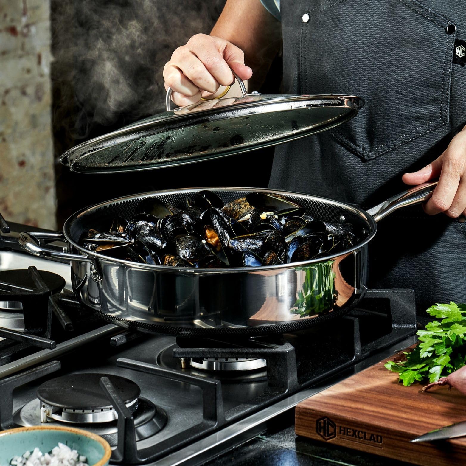 HexClad lifestyle kitchen serving sautéed vegetables from pan, convenient one-pot cooking