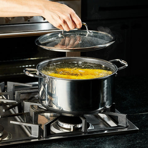 HexClad in a kitchen serving stew to guests, crowd-friendly cooking benefit
