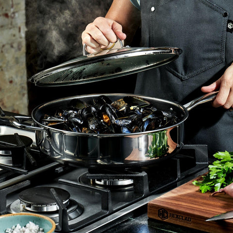 HexClad lifestyle kitchen serving sautéed vegetables from pan, convenient one-pot cooking