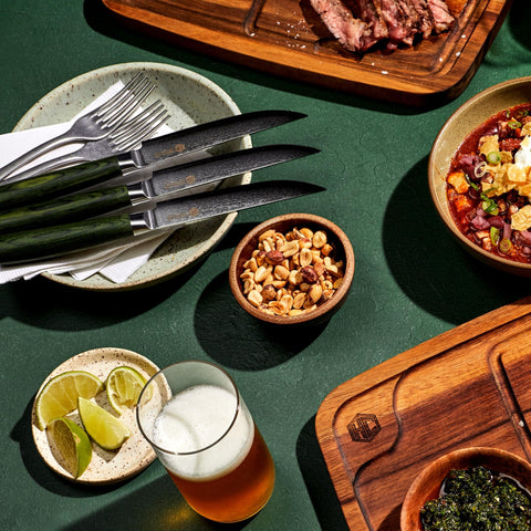 HexClad knives on a dining table paired with steak for attractive lifestyle presentation