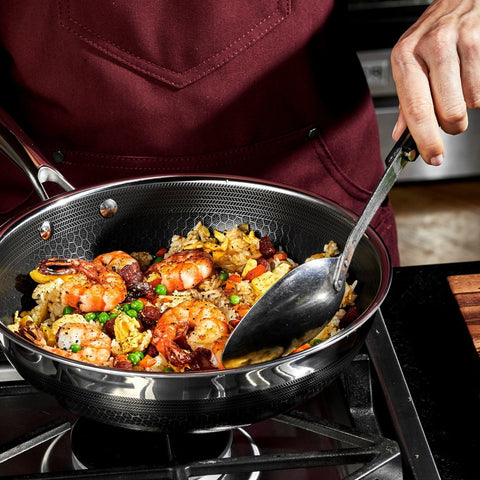 HexClad wok with box and warranty card demonstrating included lifetime protection