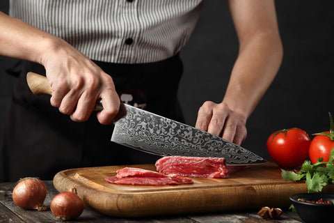 HEZHEN knife held in hand to show 8.3-inch scale and control