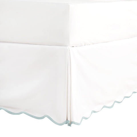 HIG front view showing scalloped pleated bedskirt and refined finish