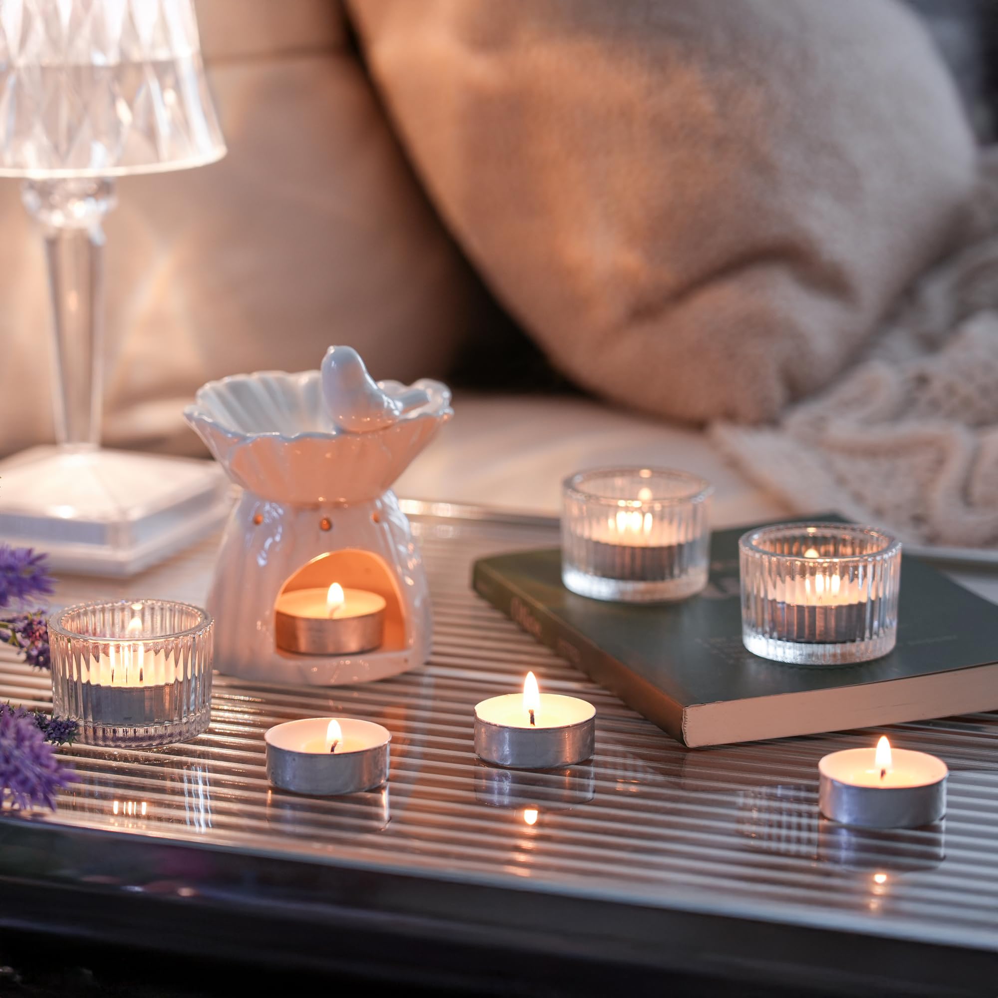 HILUMIDA tealights on outdoor table creating warm atmosphere