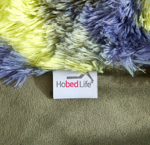 Hobed Life blanket draped over chair adding style and extra comfort