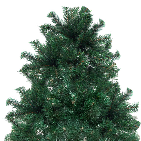 Holiday Essence tree beside chair demonstrating true 4ft scale advantage