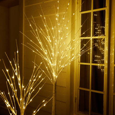 HOLILLUMA nighttime patio scene with trees creating cozy atmosphere
