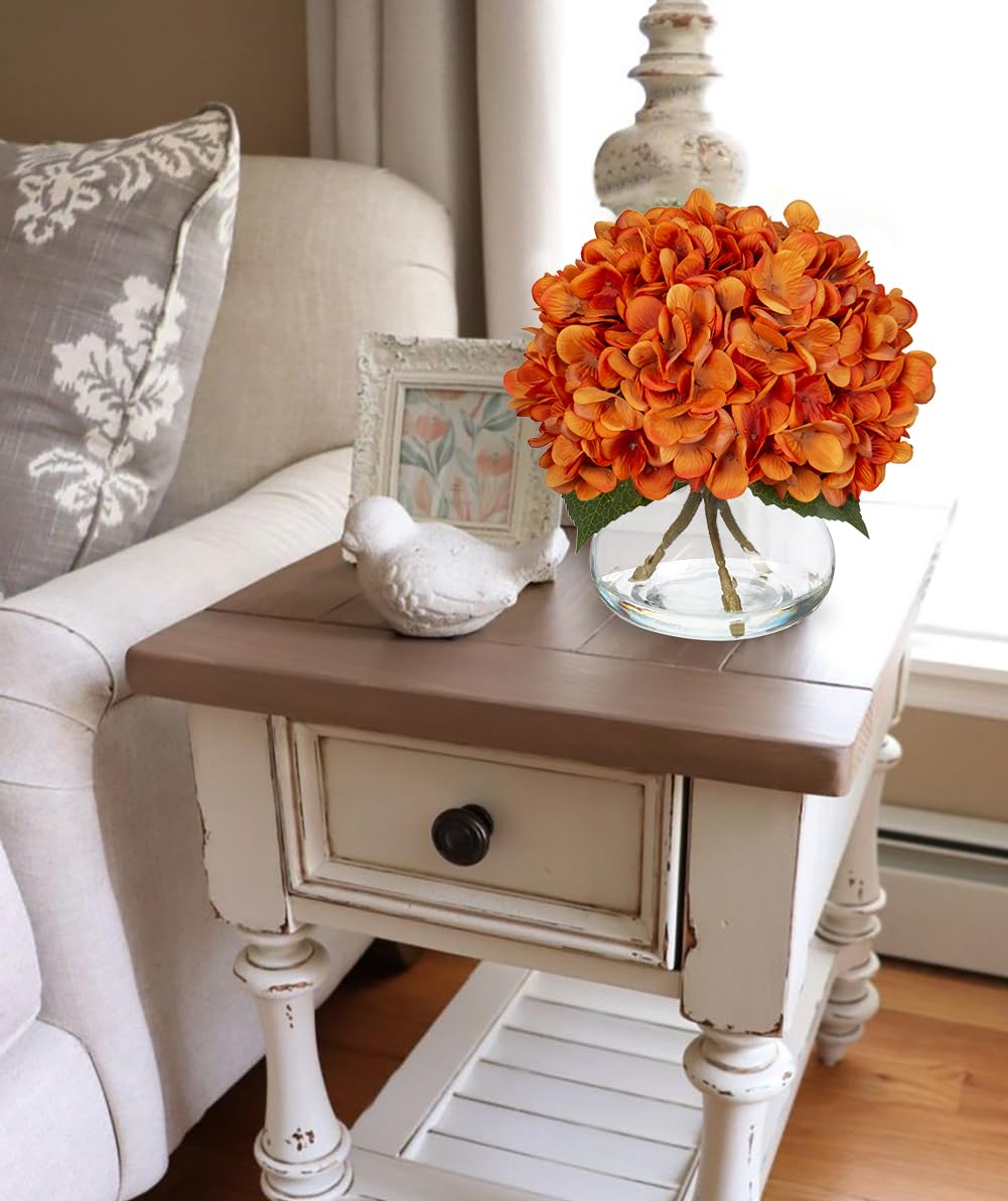 Hollyone arrangement styled on a dining table adding autumn warmth and atmosphere
