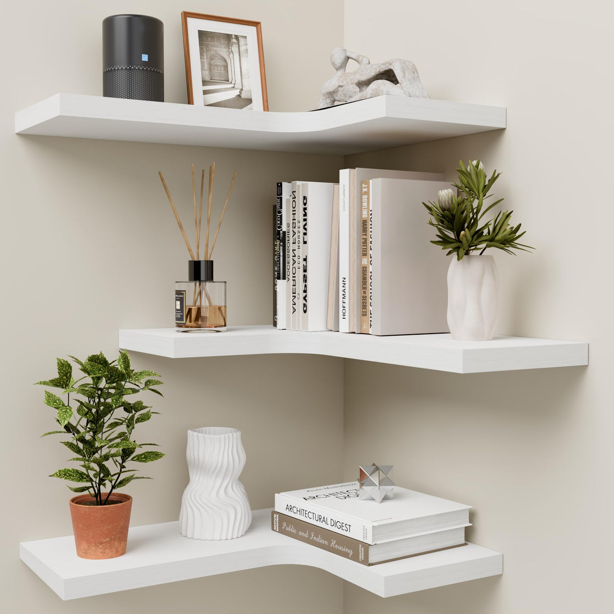 Homagle front view of three white L-shaped corner shelves showing clean lines and space-saving benefit