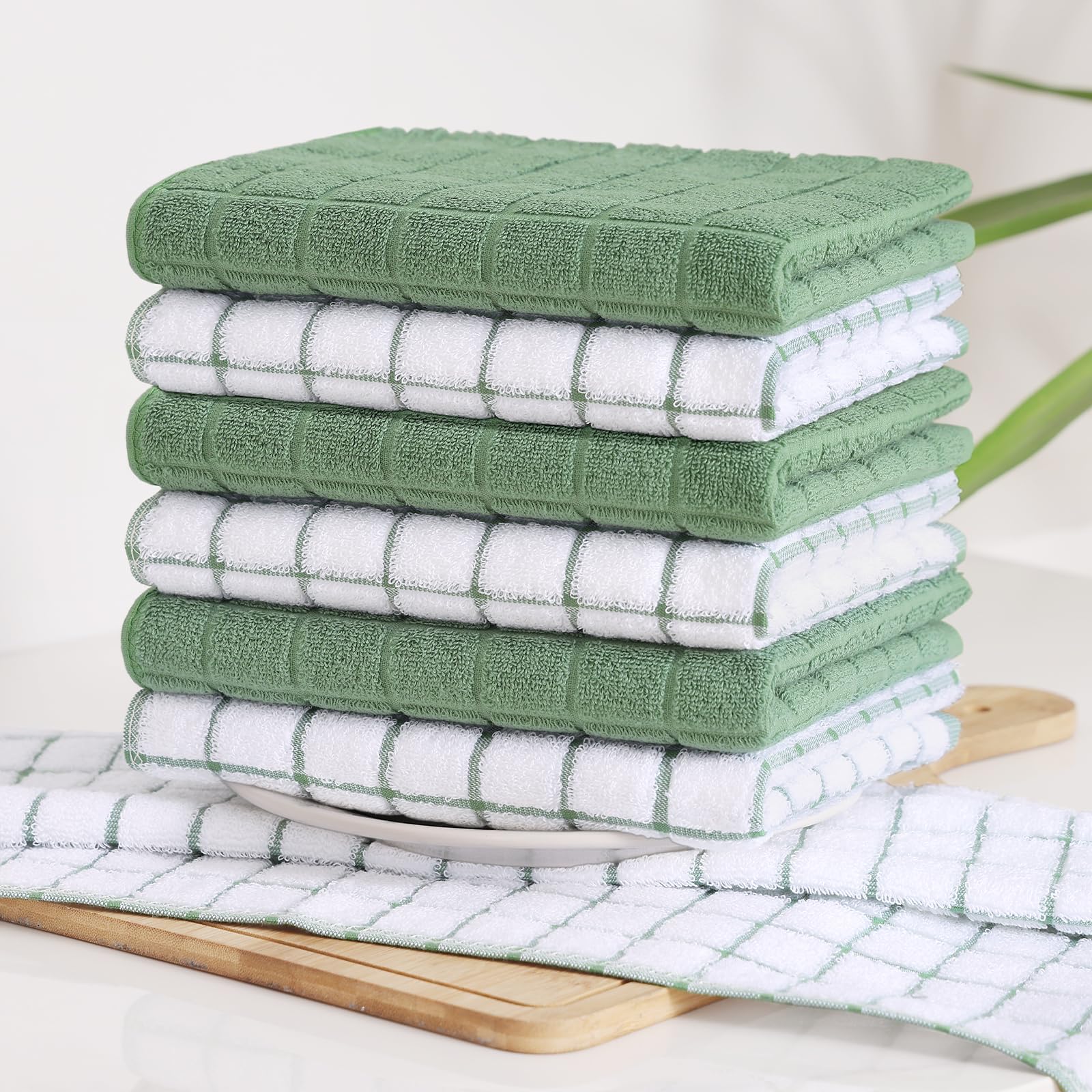 Homaxy towel soaking up spilled water demonstrating superior absorbency benefit