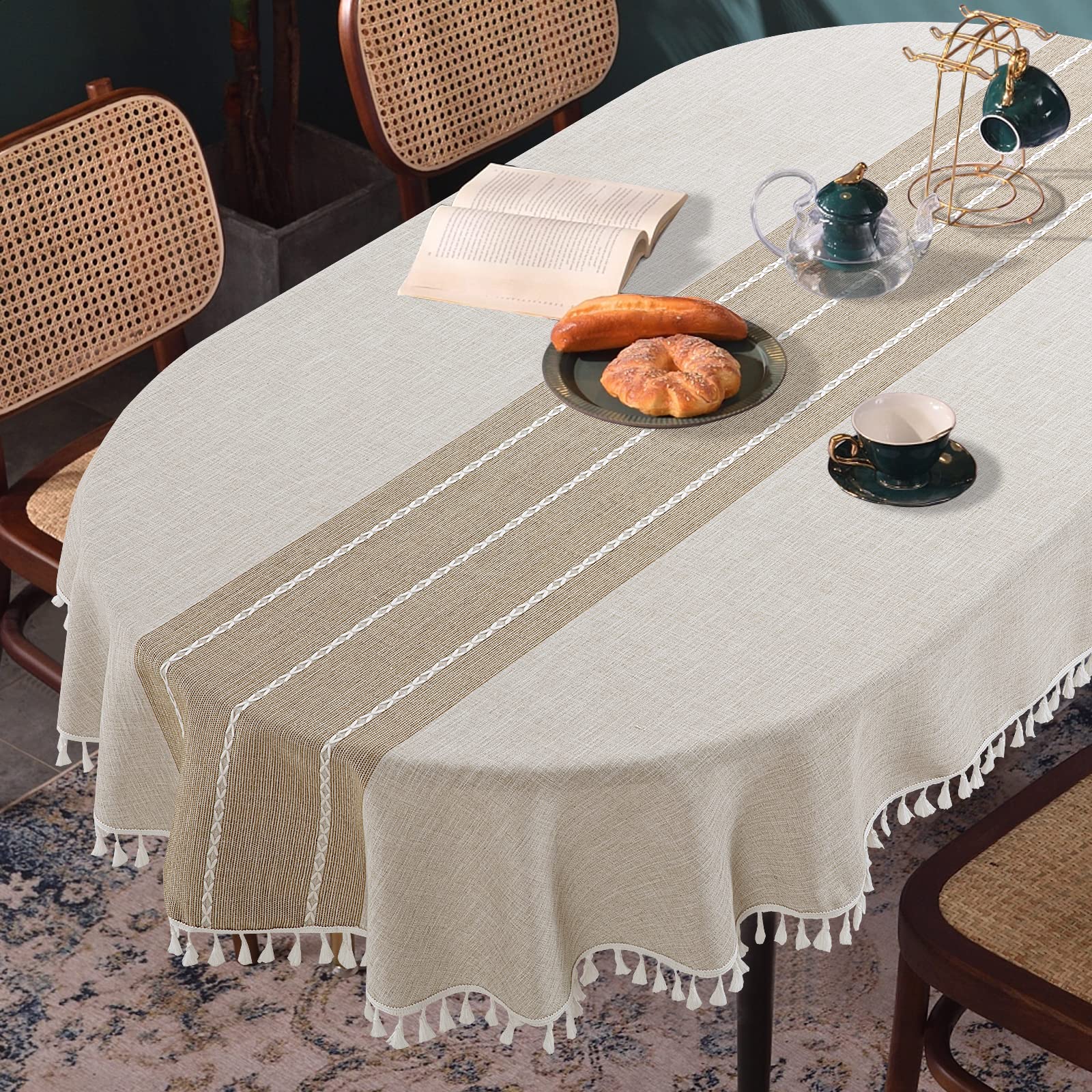 HOMBYS front view of oval tablecloth showing embroidered plaid and full drape benefit