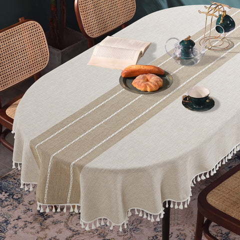 HOMBYS front view of oval tablecloth showing embroidered plaid and full drape benefit