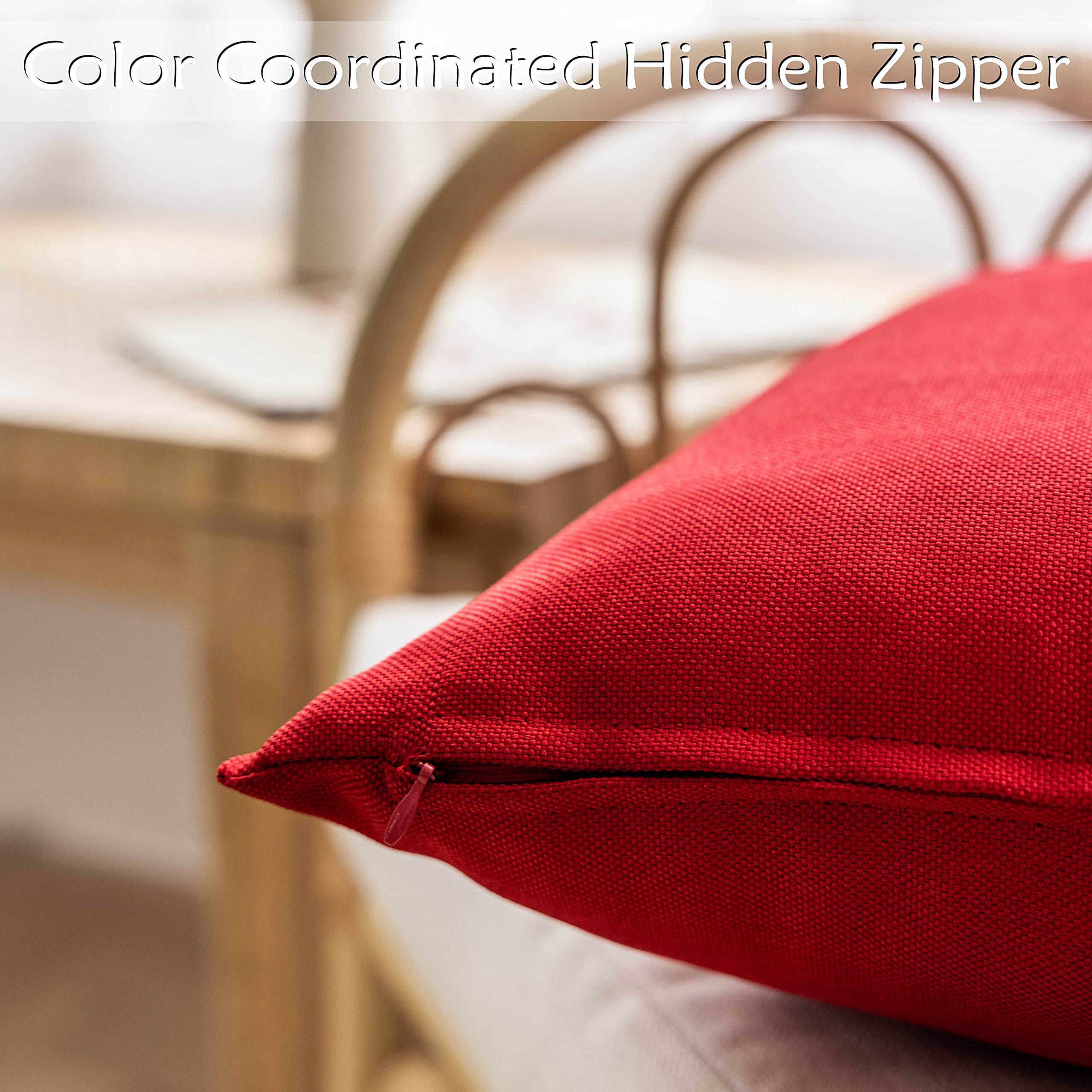 Home Brilliant red pillow cover placed on a patio chair resisting light splashes