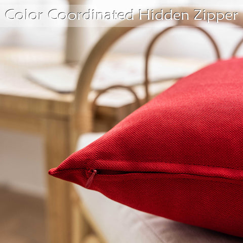 Home Brilliant red pillow cover placed on a patio chair resisting light splashes