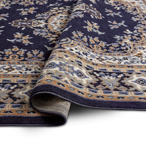 Home Dynamix rug styled in living room showing how it anchors furniture benefit: visual cohesion