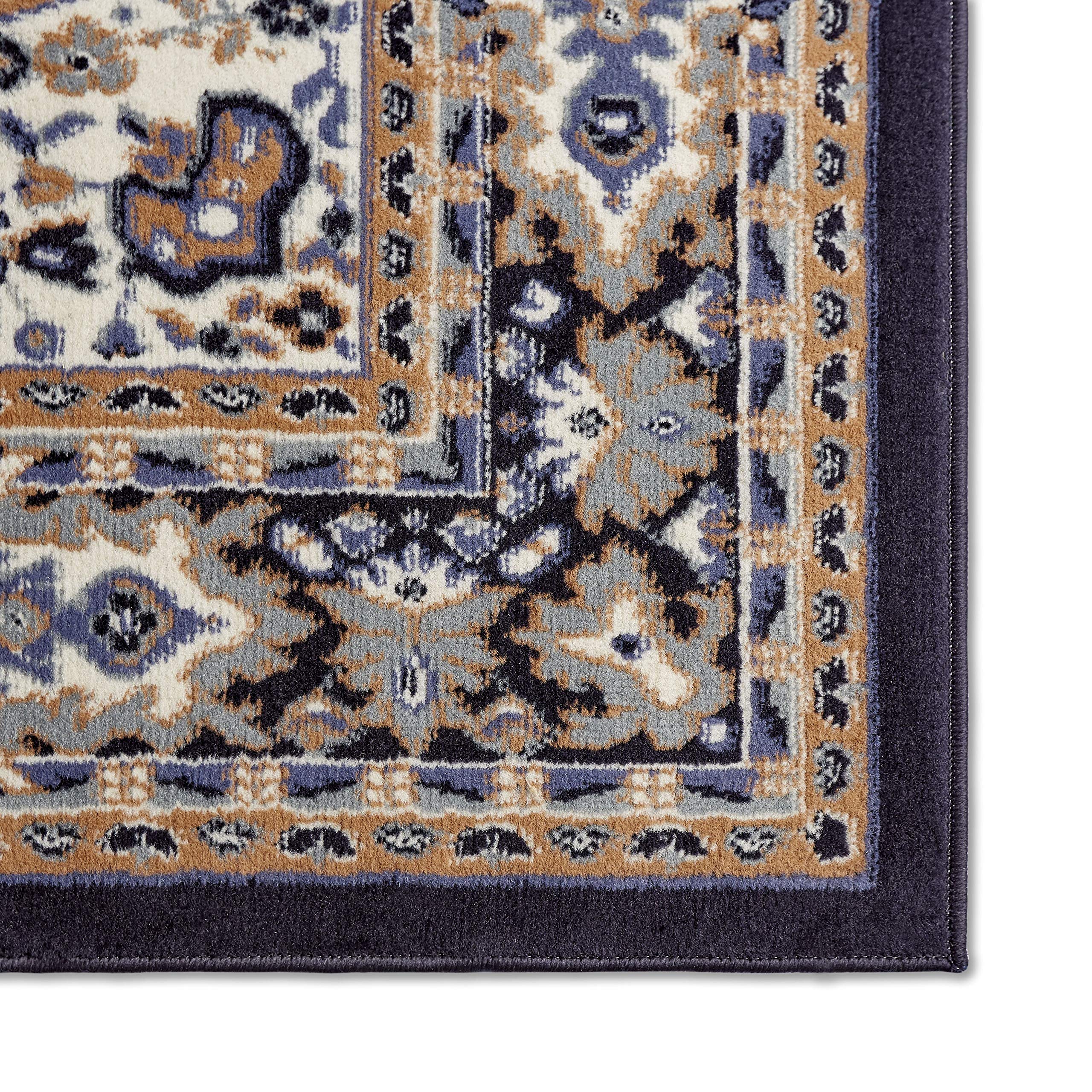 Home Dynamix rug next to sofa showing scale and fit benefit: size guidance