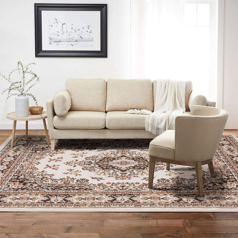 Home Dynamix rug beside chair and floor lamp showing 7'9"x10'8" scale in room