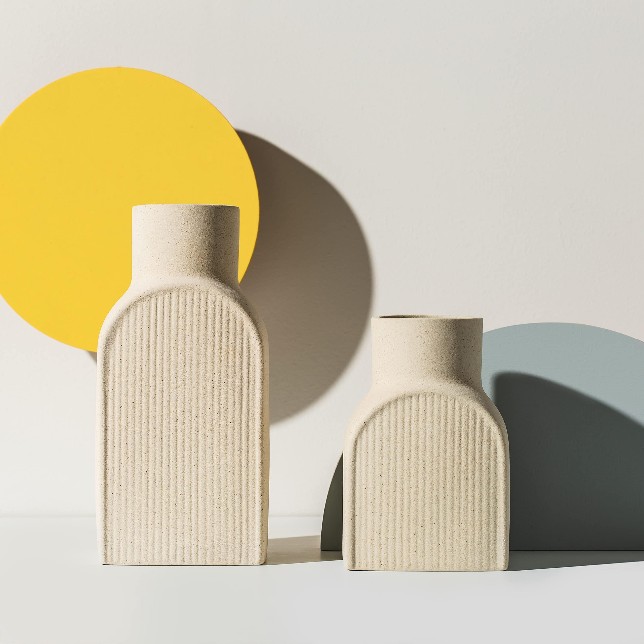 Home Habitat front view of two cream ribbed vases showing balanced design and versatility