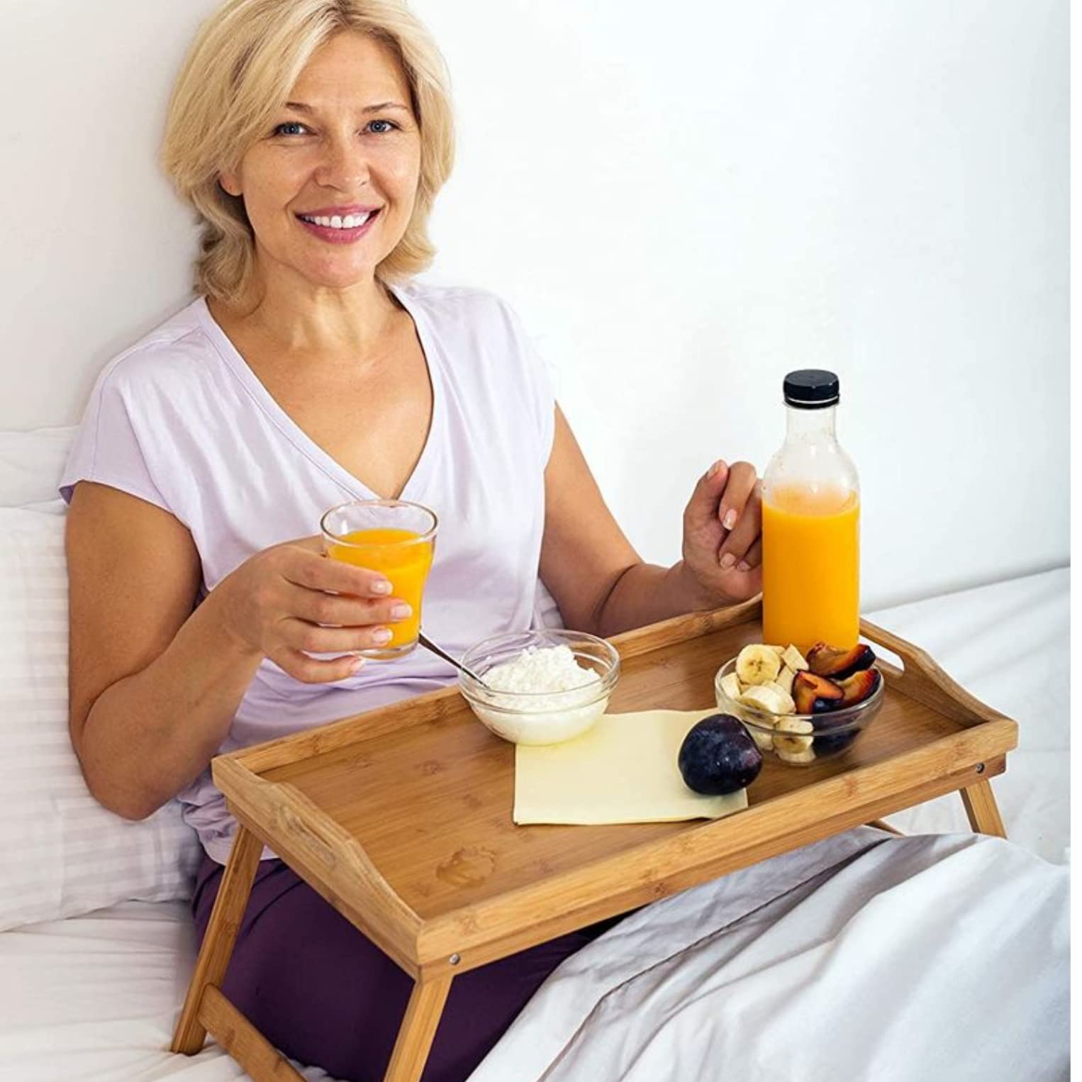 HOME IT tray with laptop on bed illustrating comfortable workspace setup