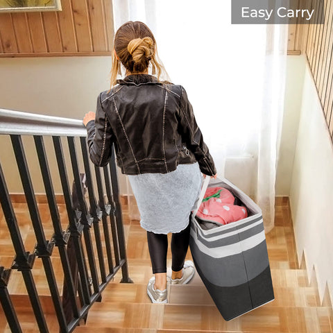 HomeHacks hamper next to pillow showing true size and volume benefit