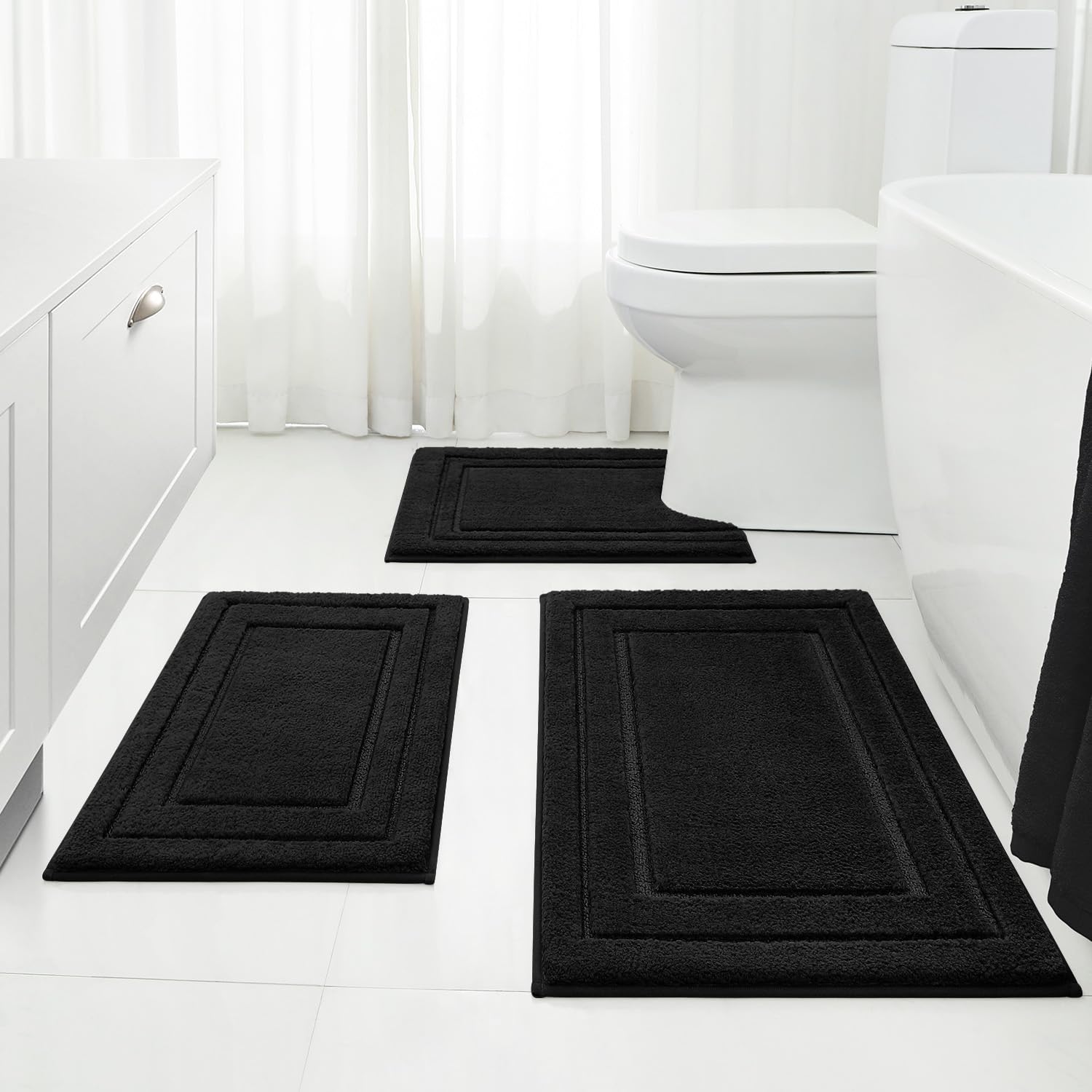 HOMEIDEAS front view of three black bath mats showing coordinated set and comfort
