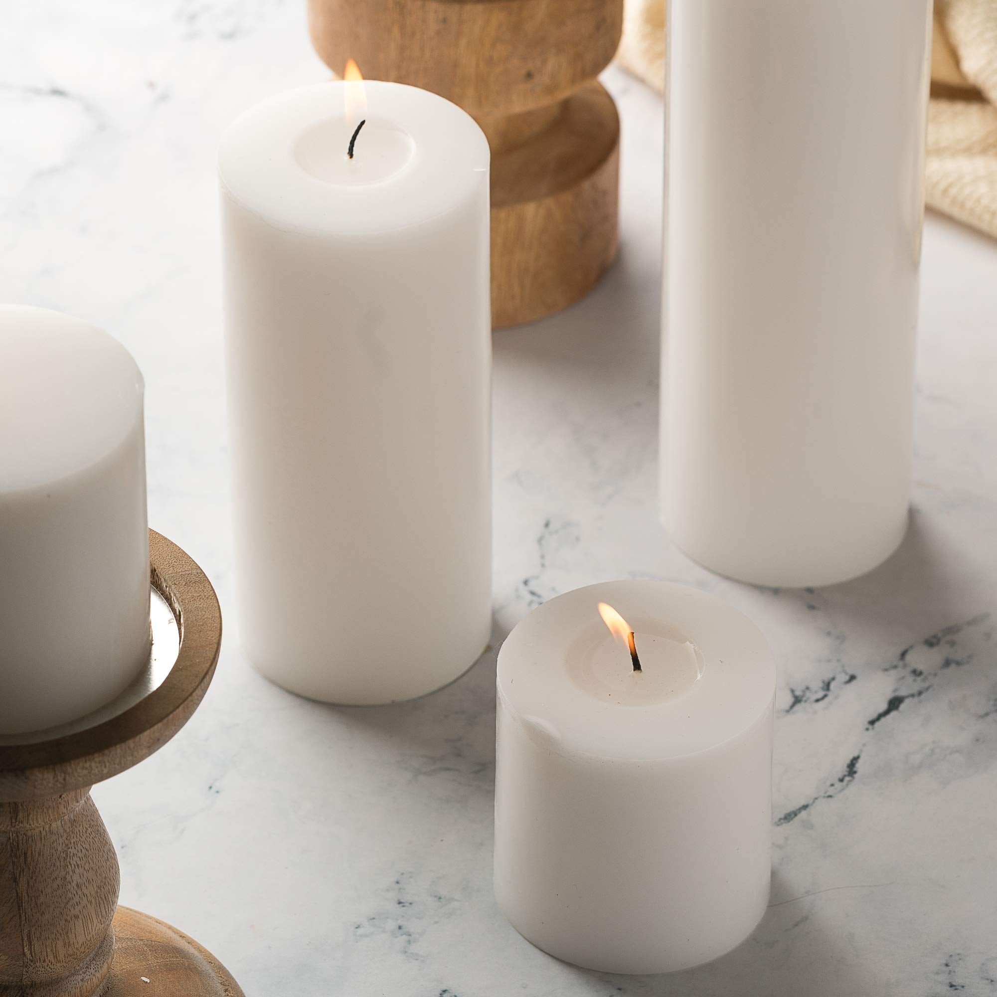 HomeLights candle burning in holder creates warm ambiance for dinners