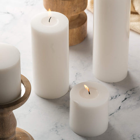 HomeLights candle burning in holder creates warm ambiance for dinners