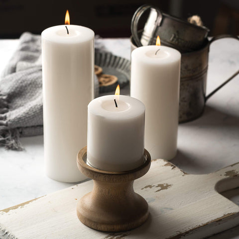 HomeLights candle on metal holder catching wax and preventing drips for cleaner surfaces