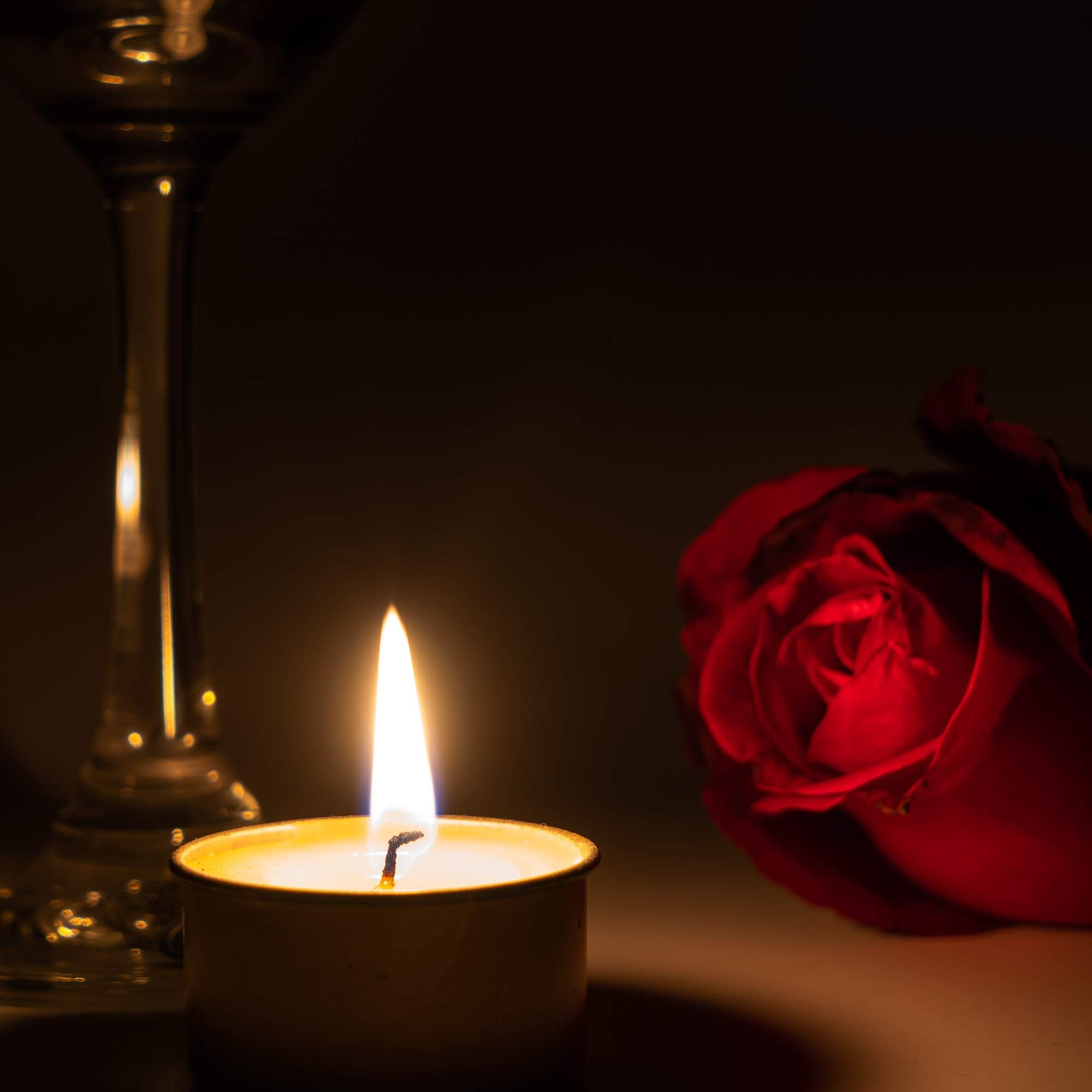 Home Lights tealight beside a hand to show size and easy placement