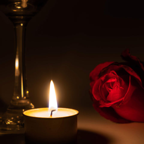 Home Lights tealight beside a hand to show size and easy placement