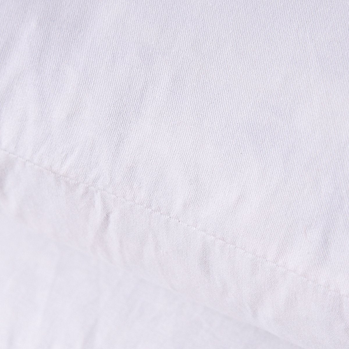 HOMESJUN pillow insert inside decorative cover on sofa showing enhanced fullness