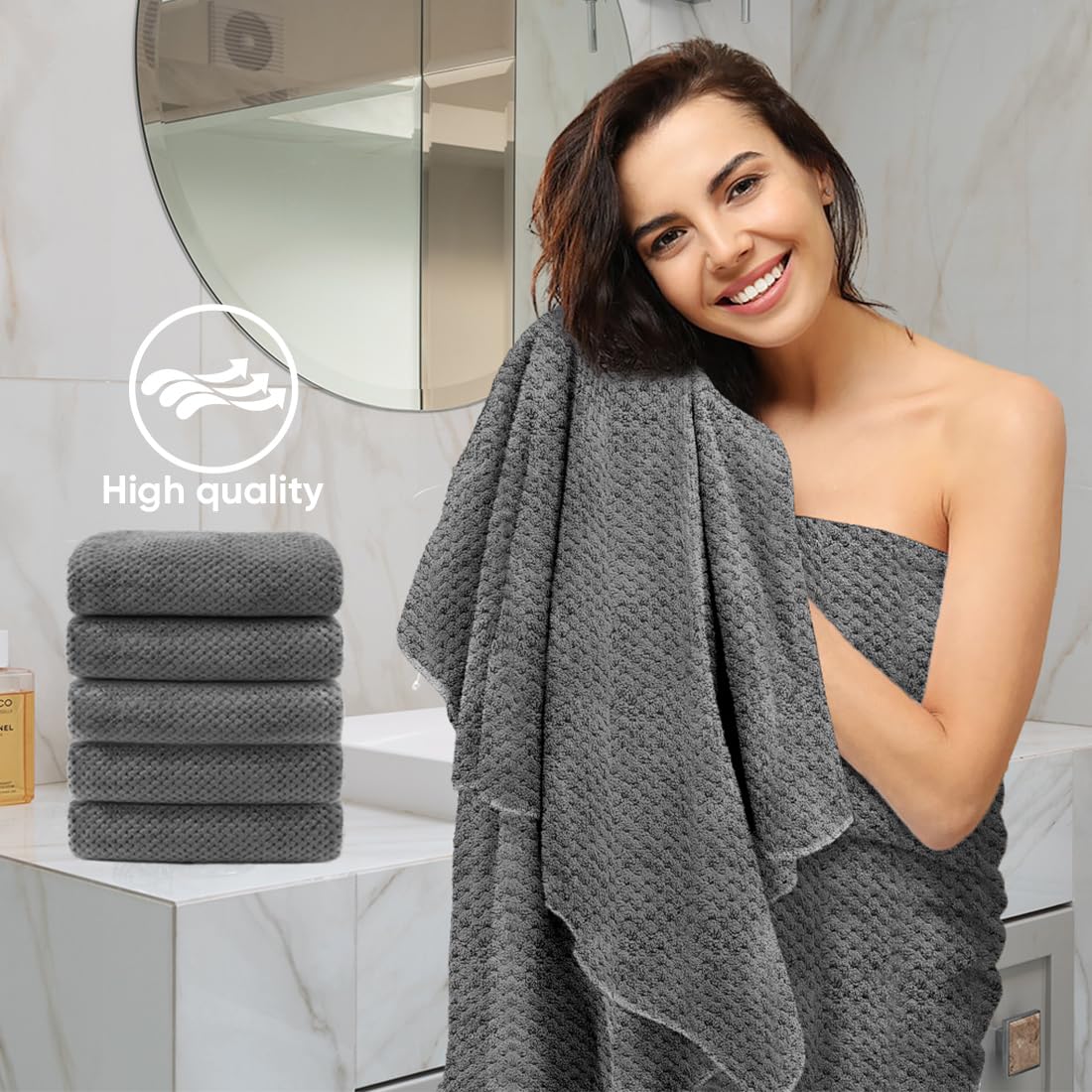 HOMEXCEL towel held by hand to show 24x48 inch size and coverage
