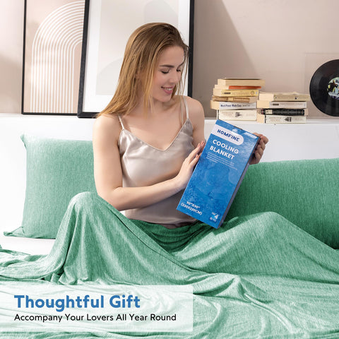 HOMFINE blanket next to pillow showing scale and generous king-size coverage benefit