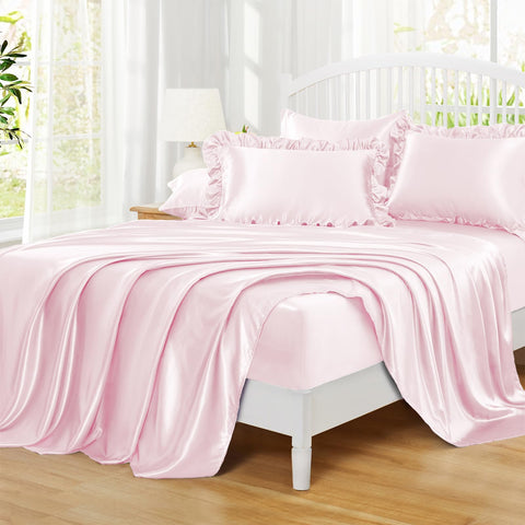 Homiest on-bed lifestyle styling with blush sheets and decor showing bedroom upgrade benefit