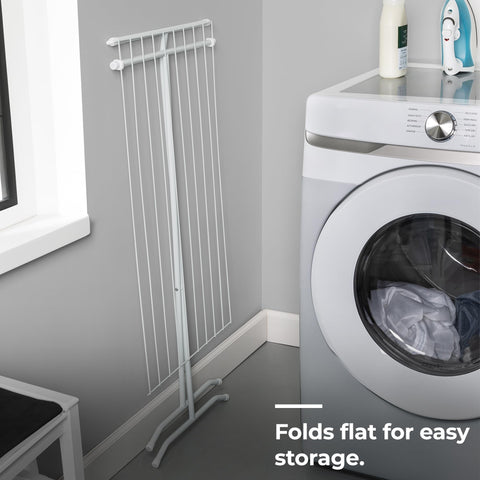 Honey-Can-Do drying rack in a laundry room holding mixed wet garments efficiently