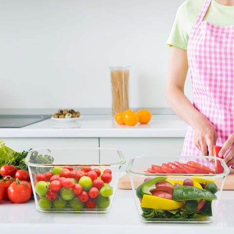 Hontent container next to a cutting board and apple, displays true size and scale