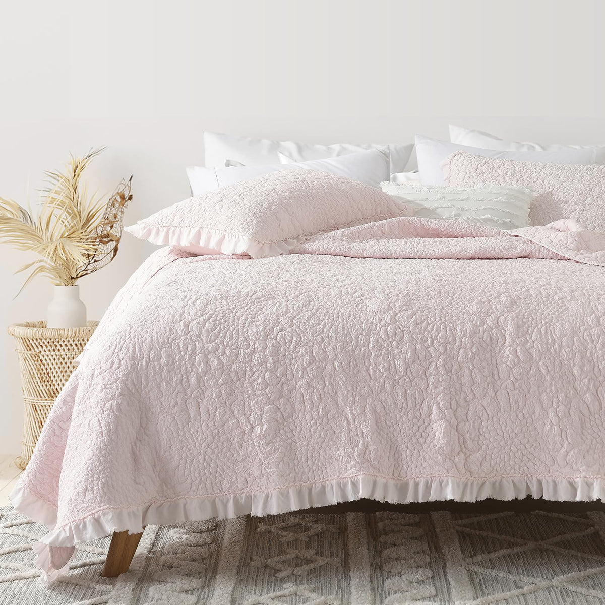 HORIMOTE HOME front view of pink ruffled queen quilt showing cozy benefit