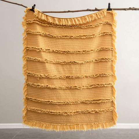 HORIMOTE HOME throw styled on bed demonstrating layered bedroom warmth
