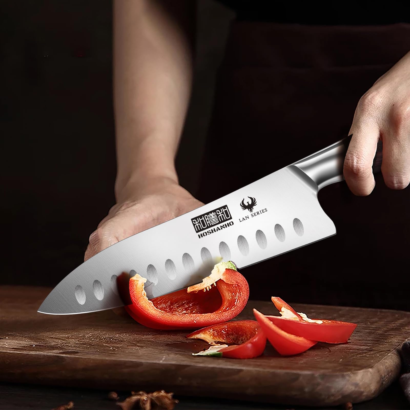 HOSHANHO knife next to hand for scale illustrating the compact 7" versatile size