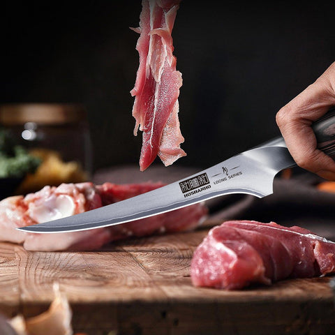 HOSHANHO knife on cutting board with plated fish showing presentation benefit