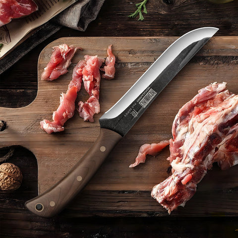 HOSHANHO knife next to hand for scale, clear size and balance indication