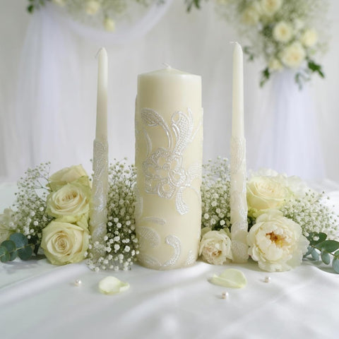 Hosley candles lit in dim room providing warm ambience for ceremonies