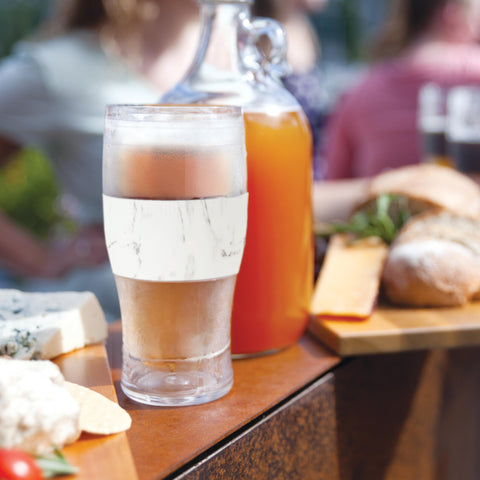 Host pint on picnic table at barbecue keeping beverages chilled