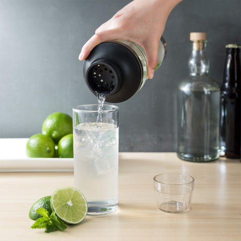 Host shaker being poured through strainer to glass for smooth cocktails benefit