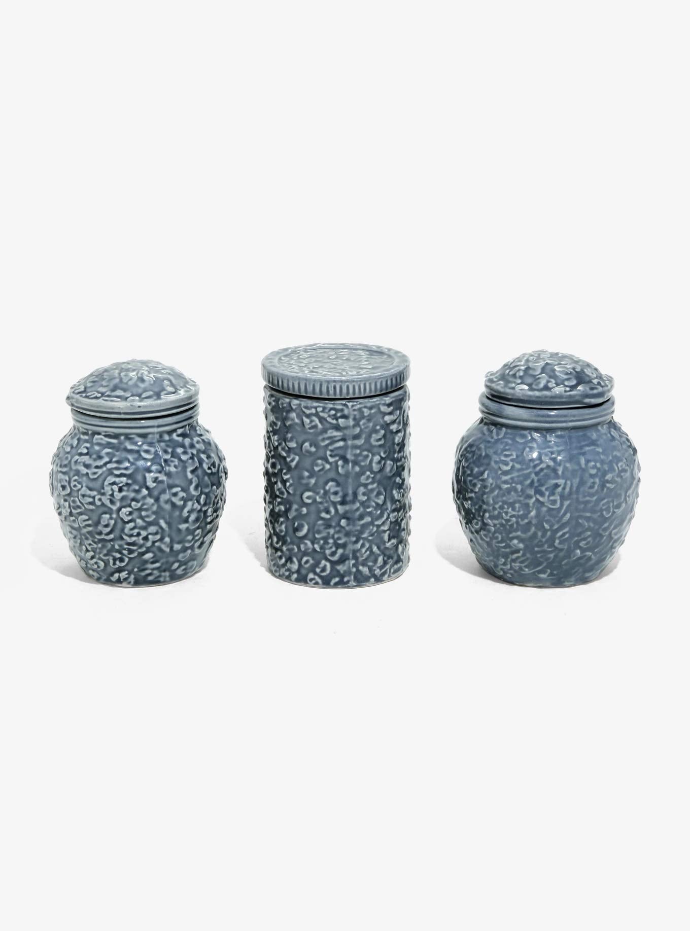 Hot Topic jars on a vanity holding rings and earrings showing organized storage benefit