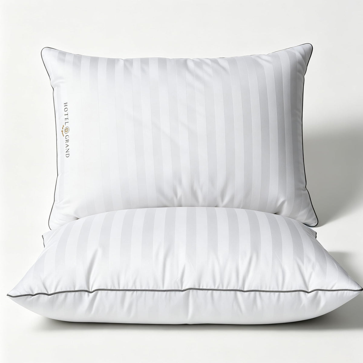 Hotel Grand front view of king pillow showing clean white stripes and plush benefit