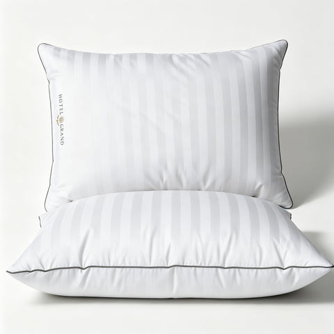 Hotel Grand front view of king pillow showing clean white stripes and plush benefit